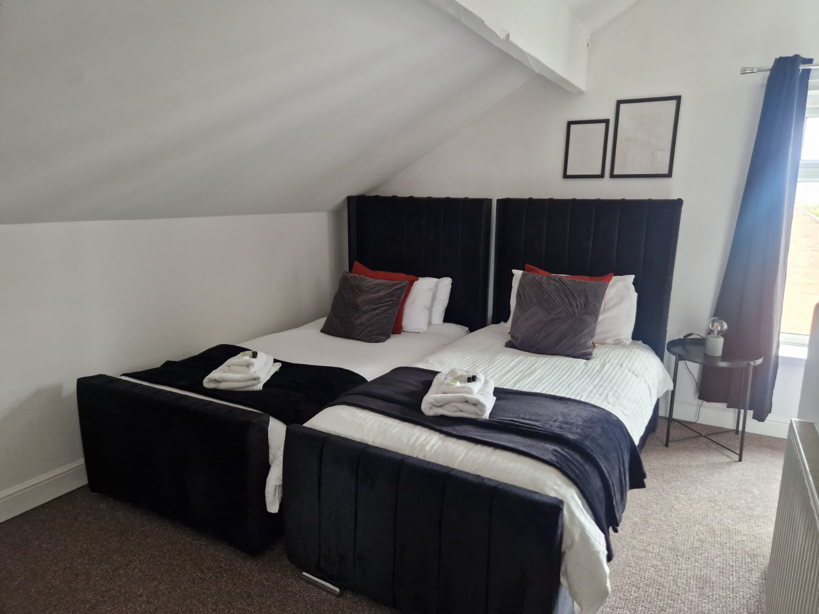 Two single-beds with white sleek sheets for contractor accommodation by hmh stays