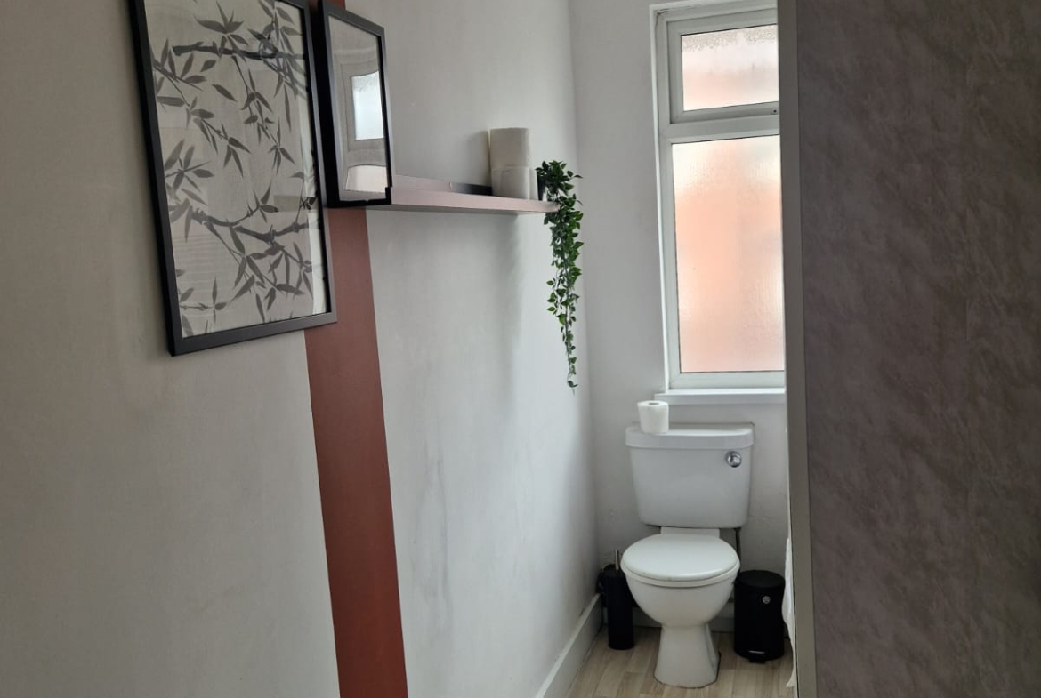 White commode in the bathroom of the property listed by hmh stays