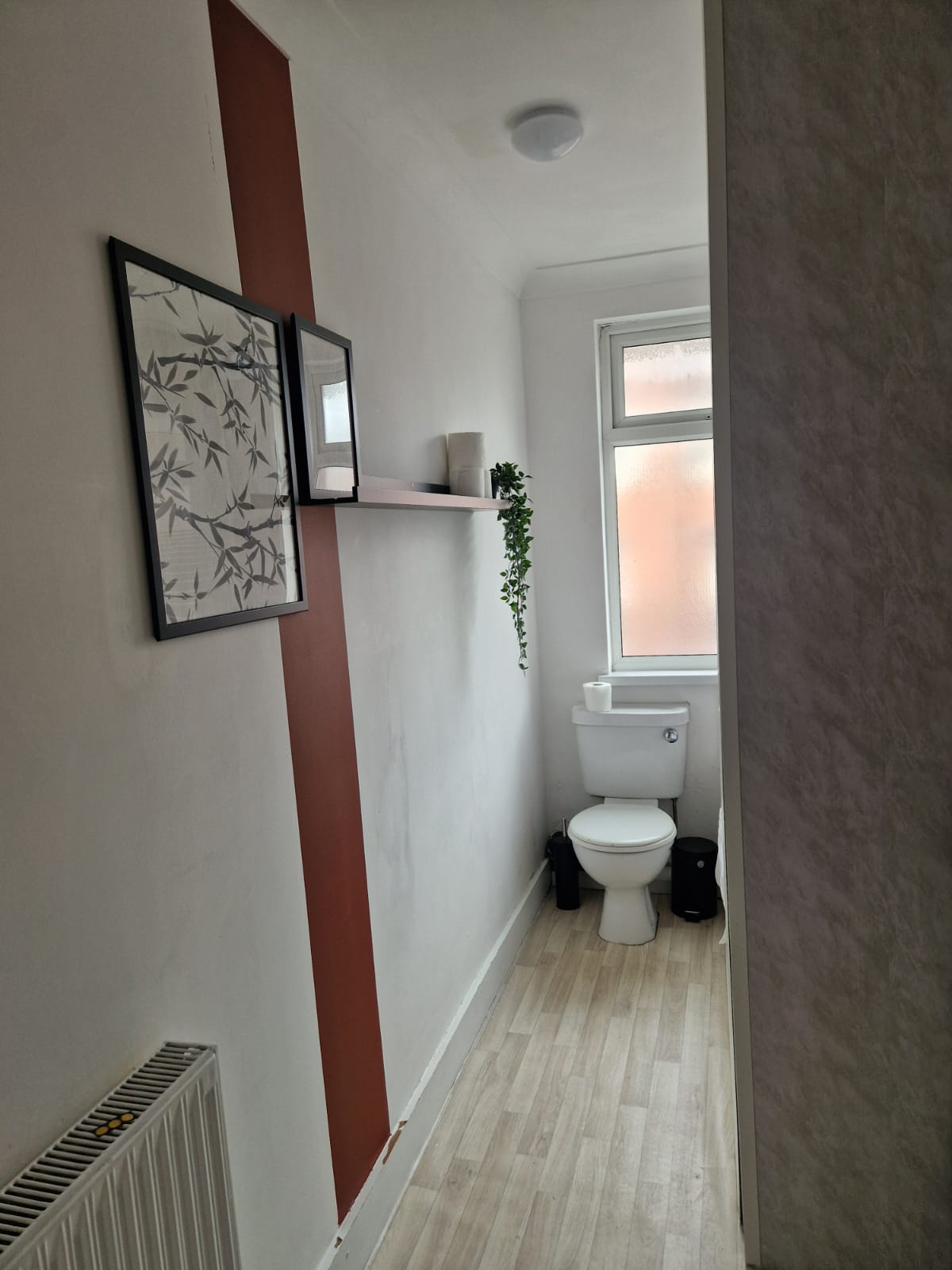 White commode in the bathroom of the property listed by hmh stays