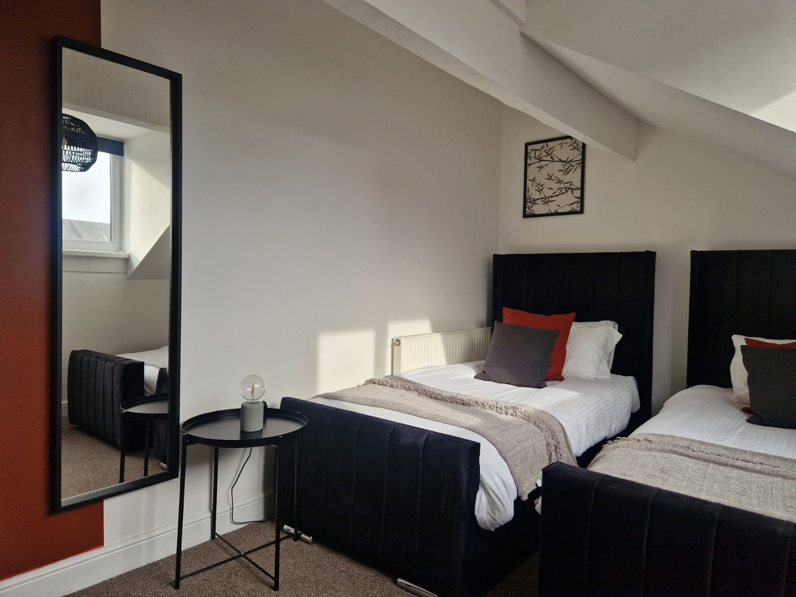 Two single beds listed by hmh stays in UK