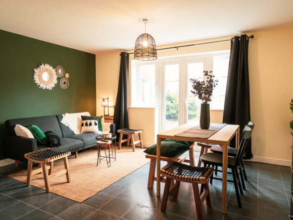 Dining table with sofa set in the property of HMH Stays providing long-term accommodation