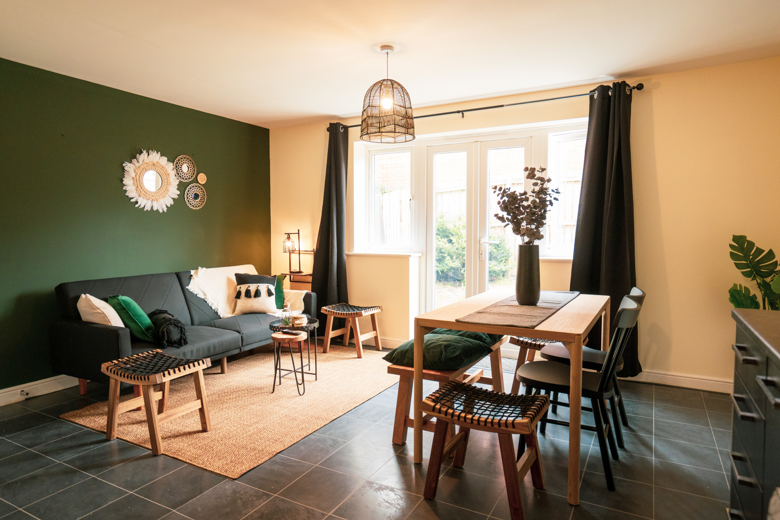 Dining table with sofa set in the property of HMH Stays providing long-term accommodation