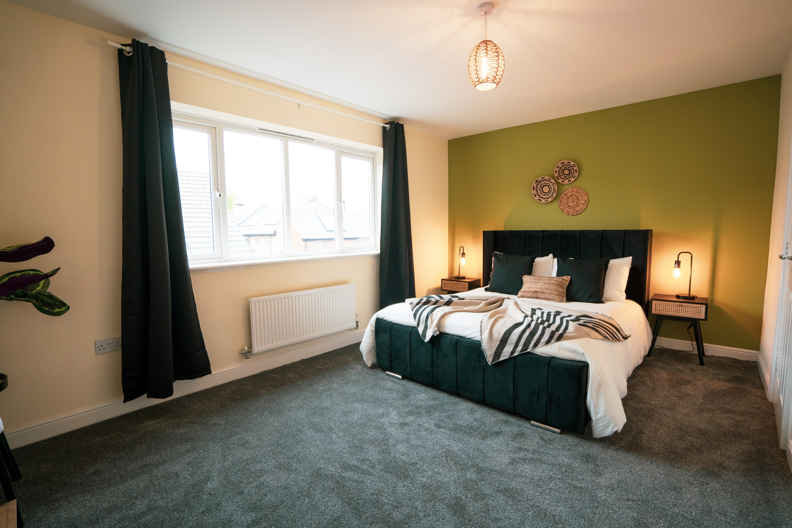 King-size bedroom with lamps for contractors by HMH Stays providing long-term accommodation