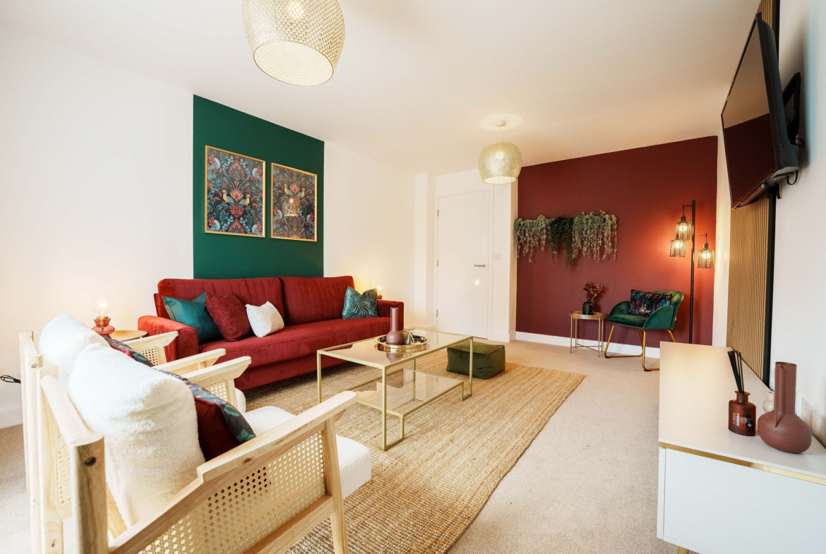 Red and white sofa set listed in HMH Stays property providing long-term accommodation for contractors