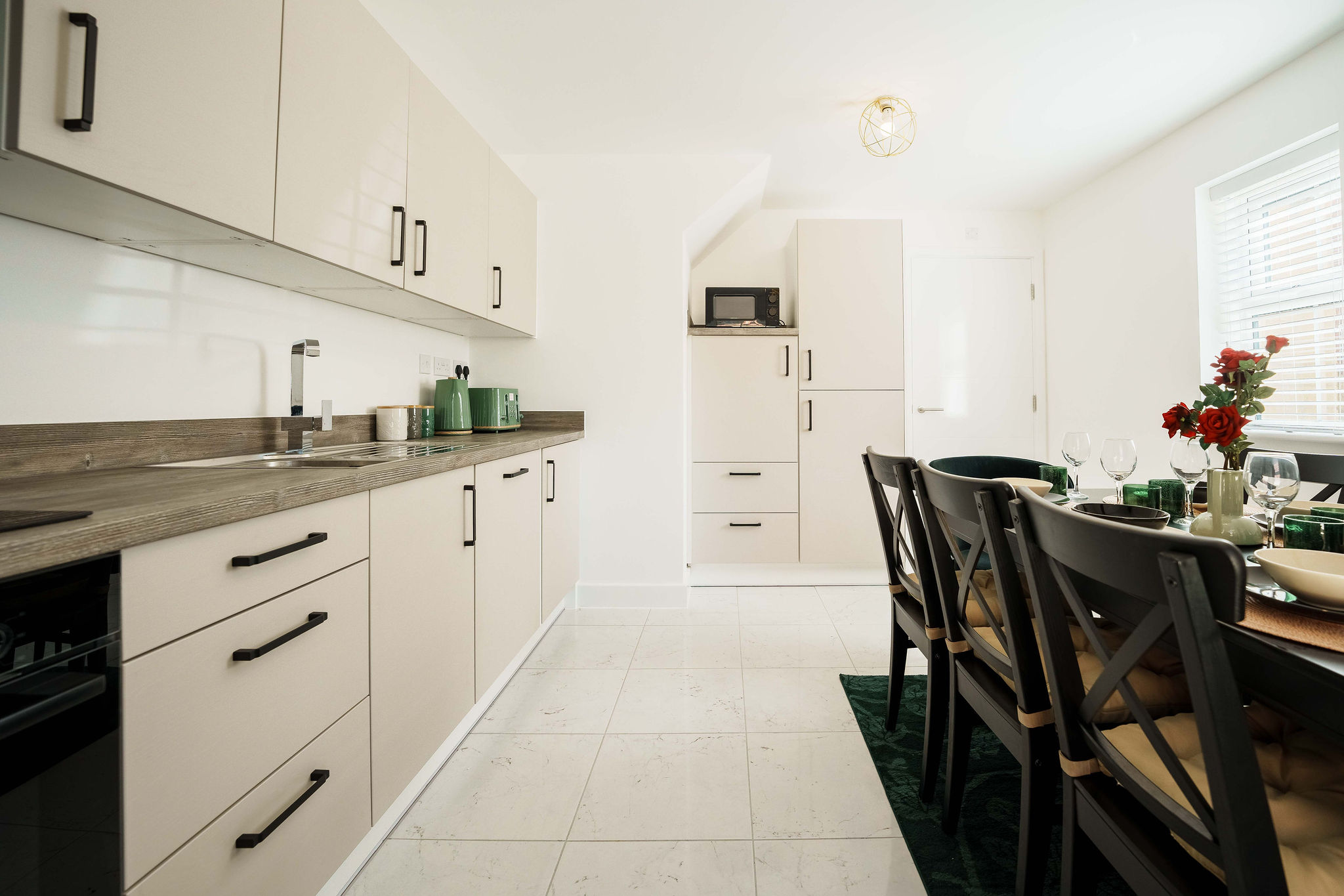 Dining table and kitchen for contractors listed by HMH Stays providing long-term accommodation
