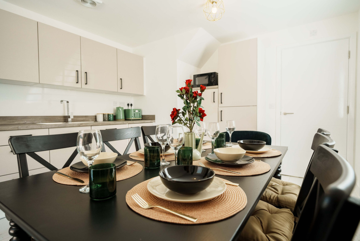 Dining table with cutlery for contractors listed by HMH Stays providing long-term accommodation