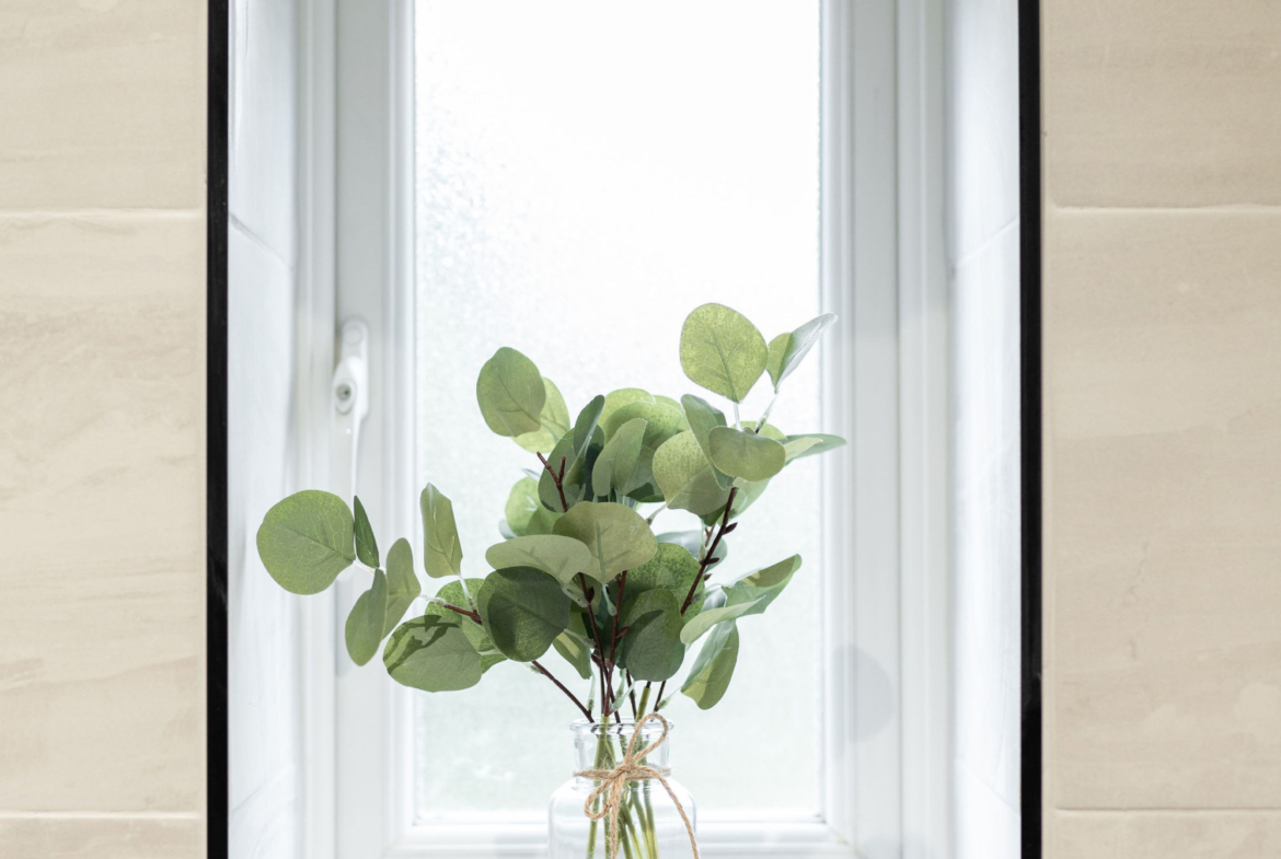 White window with leaves in the property of hmh stays providing contractor long-term accommodation