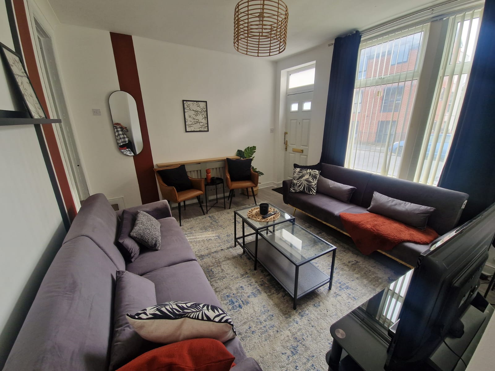 TV lounge with sofa set and table listed by hmh stays in UK