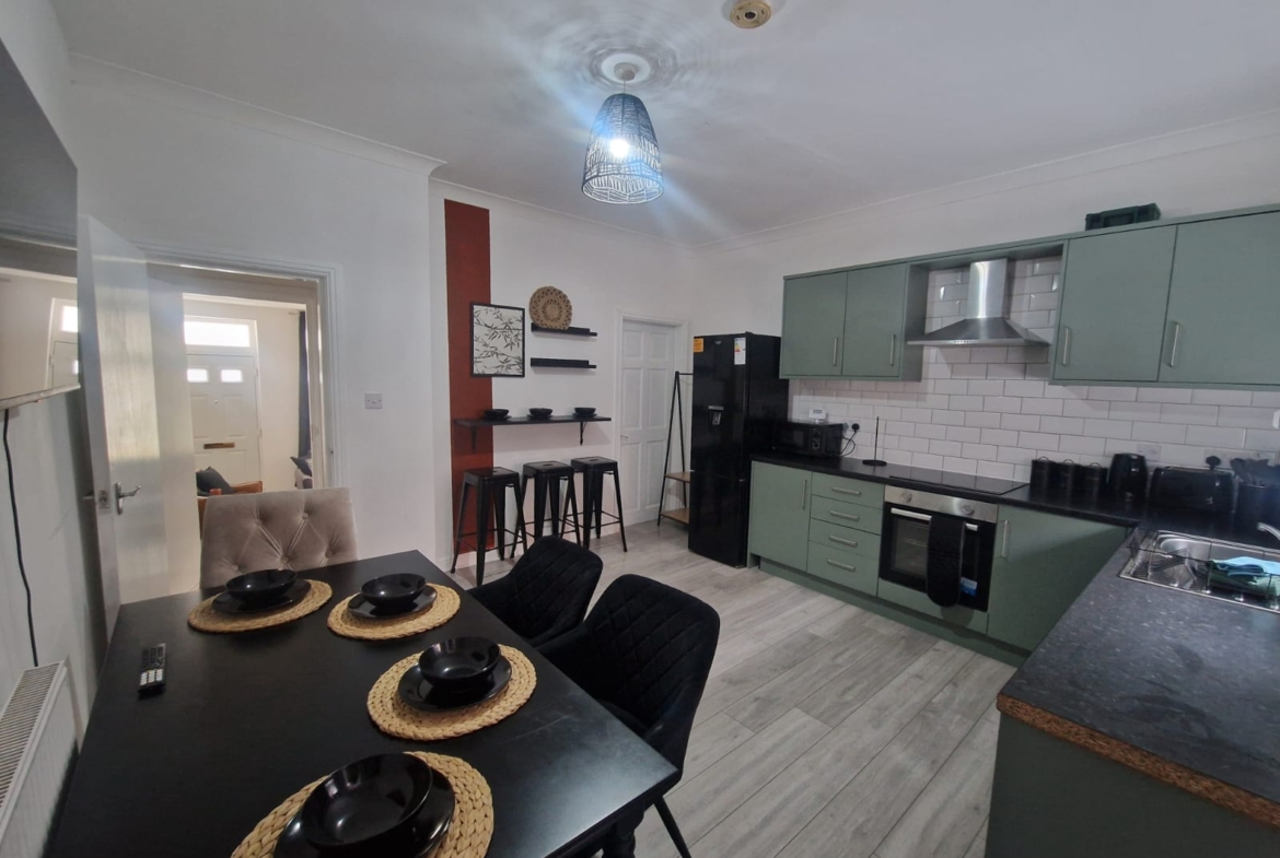 Dining-table with black dishes listed by hmh stays in UK