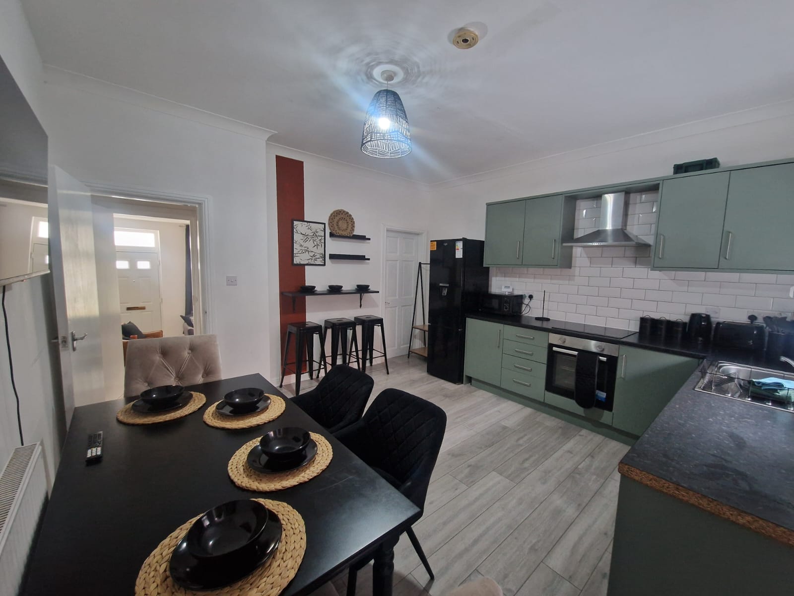 Dining-table with black dishes listed by hmh stays in UK