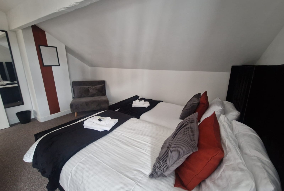 Queen-size and single bedroom listed by hmh stays in UK