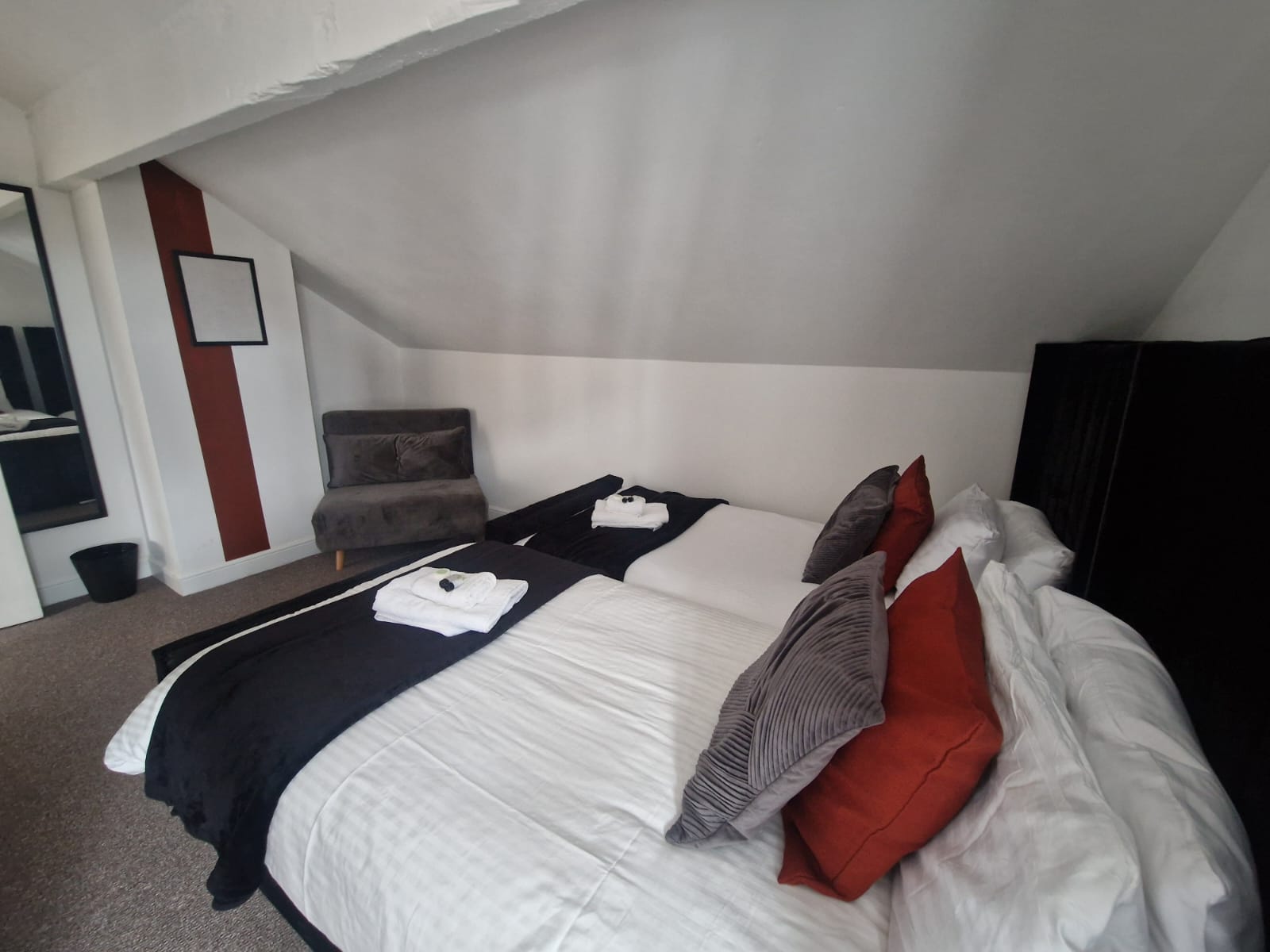 Queen-size and single bedroom listed by hmh stays in UK