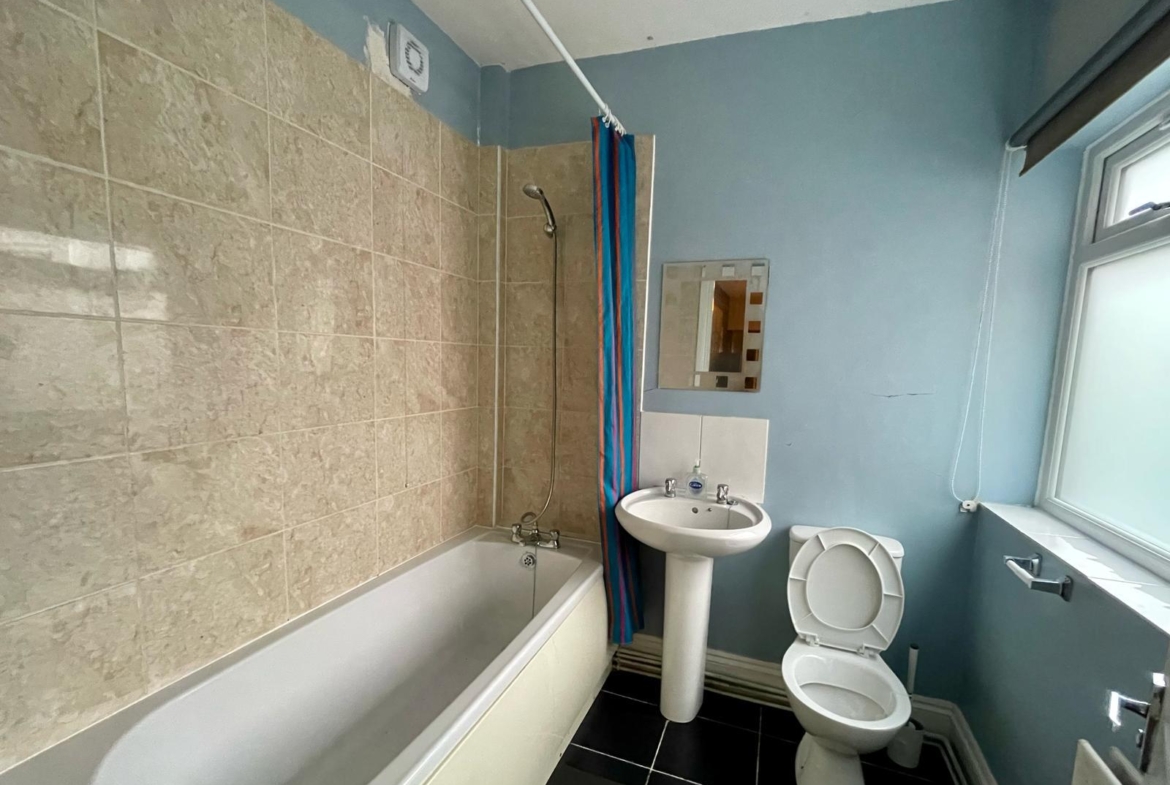 Full bathroom with the tub for the accommodation of contractors